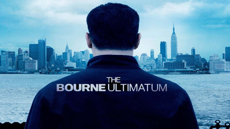 Matt Damon from 'The Bourne Ultimatum' looking away from the camera at the city skyline