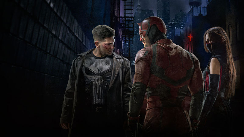 Punisher and Elektra next to the lead actor from 'Daredevil' on Netflix in a dark alley