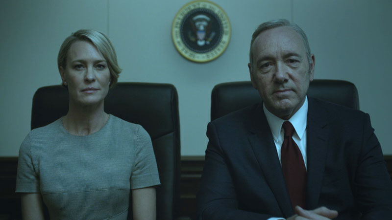 The two lead actors from 'House of Cards' on Netflix sitting in chairs looking towards the viewer