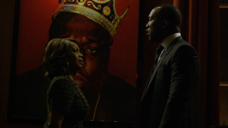 Two actors from 'Luke Cage' on Netflix arguing in front of a painting