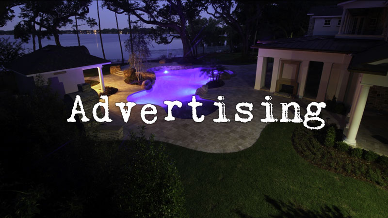 Advertising with a backyard pool lit with a purple light at night