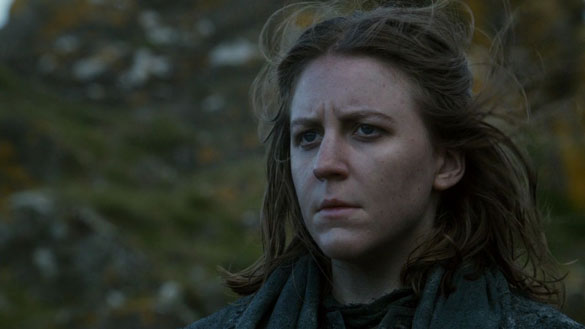 Yara Greyjoy from 'Game of Thrones' in a dark outfit looking troubled