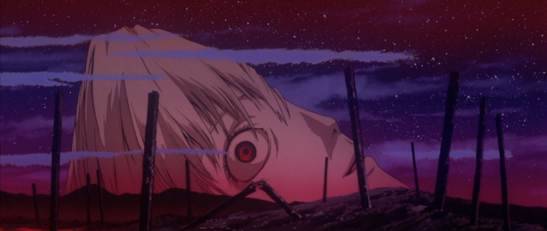 Rei's giant split in half head from End of Evangelion laying against a bloody wasteland